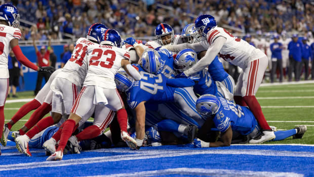 Aug 11, 2023; Detroit, Michigan, USA; Detroit Lions quarterback Adrian Martinez (18) scores the game-winning touchdown against the New York Giants in the fourth quarter at Ford Field.